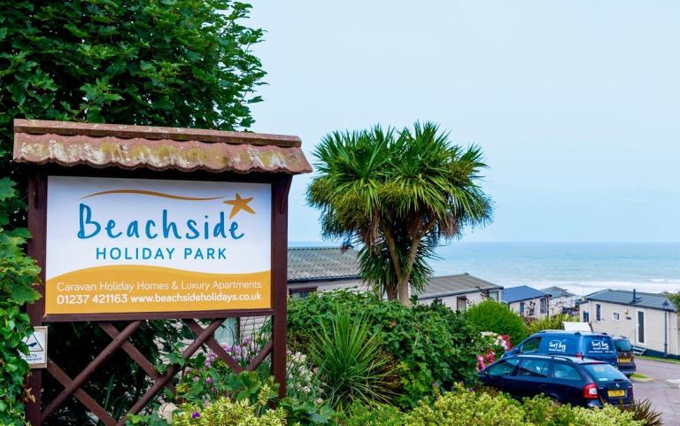 Holiday Park Sign and Holiday Homes with Sea views