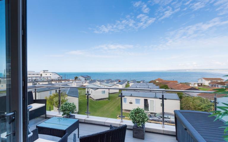 View from an Apartment Outside Decking Looking out over other Accommodation and the Sea