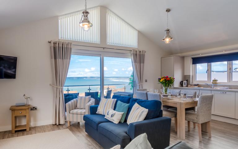 Lounge and Dining Area with Sea Views of an Apartment