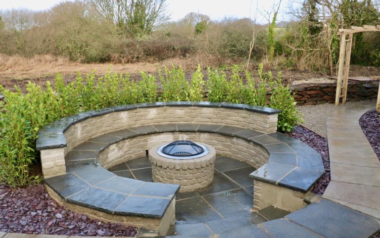 Outdoor View of a Cottages in Beautiful Gardens Featuring outdoor Fire Place