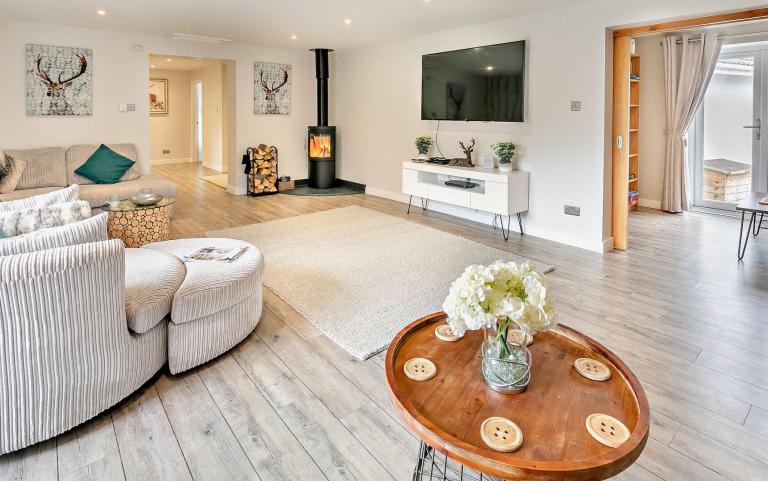 Lounge Area in a Luxury Holiday Home Featuring a Log Burner