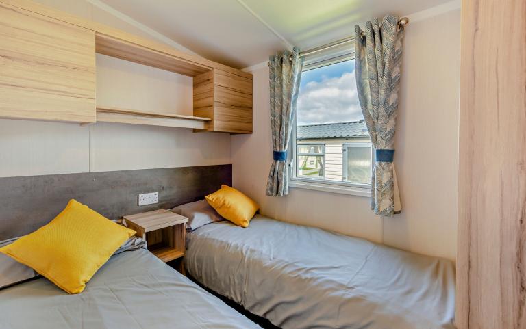 Twin Beds in a Bedroom Area of a Caravan Holiday Home