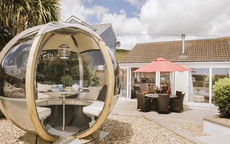 Outside View of a Holiday Home with a Decking area & Bespoke Outdoor Eating area