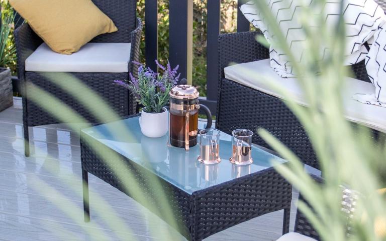 Coffee and Cups in the Seating Area of a Decking Area of a Pod Style Holiday Home 