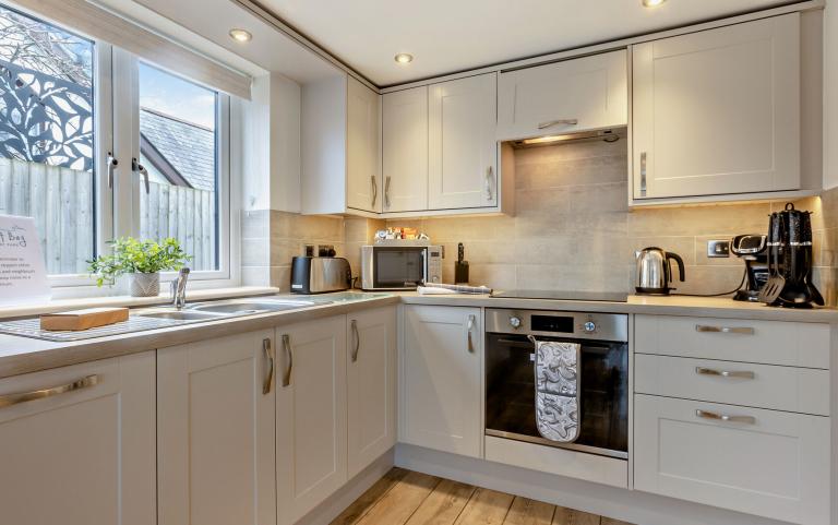 the modern kitchen in the Sandymere apartment