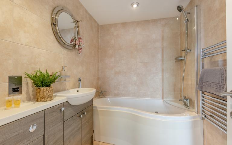 Main bathroom of Waterfront apartment with jacuzzi bath