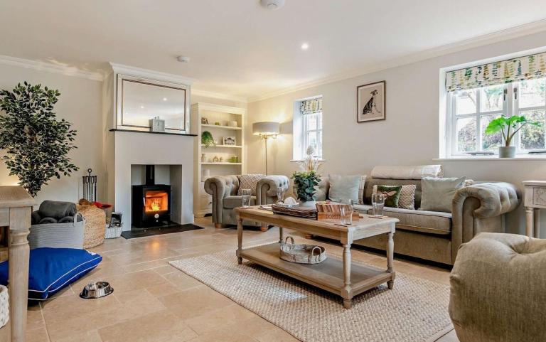 Living area of a Holiday Home featuring a Log Burner