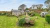 Outdoor View of Cottage in Beautiful Gardens