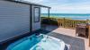 Outside Decking Area of a Caravan Holiday Home with a Hot Tub which benefits from Views over the Sea