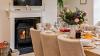 Dining Area in a Holiday Home Featuring a Log Burner