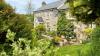 Outdoor View of Cottage in Beautiful Gardens