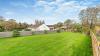 Outdoor View of Cottage in Beautiful Gardens 