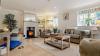 Living area of a Holiday Home featuring a Log Burner